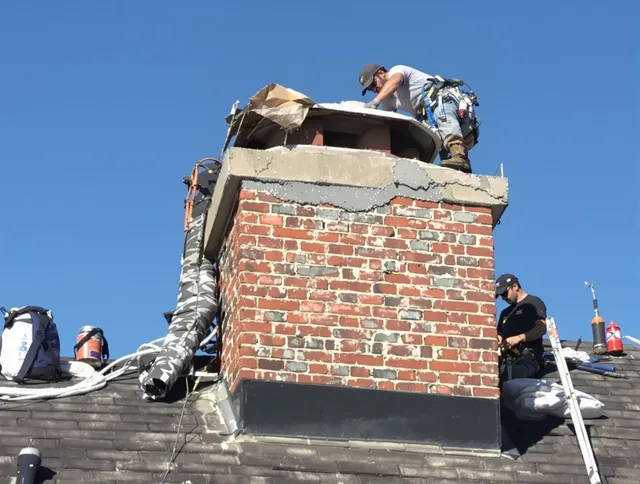 Bellflower Chimney Sweep installing a custom chimney crown in Bellflower, CA