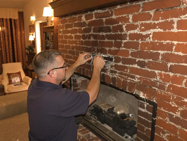 Bellflower Chimney Sweep expert fixing a fireplace in Bellflower, CA